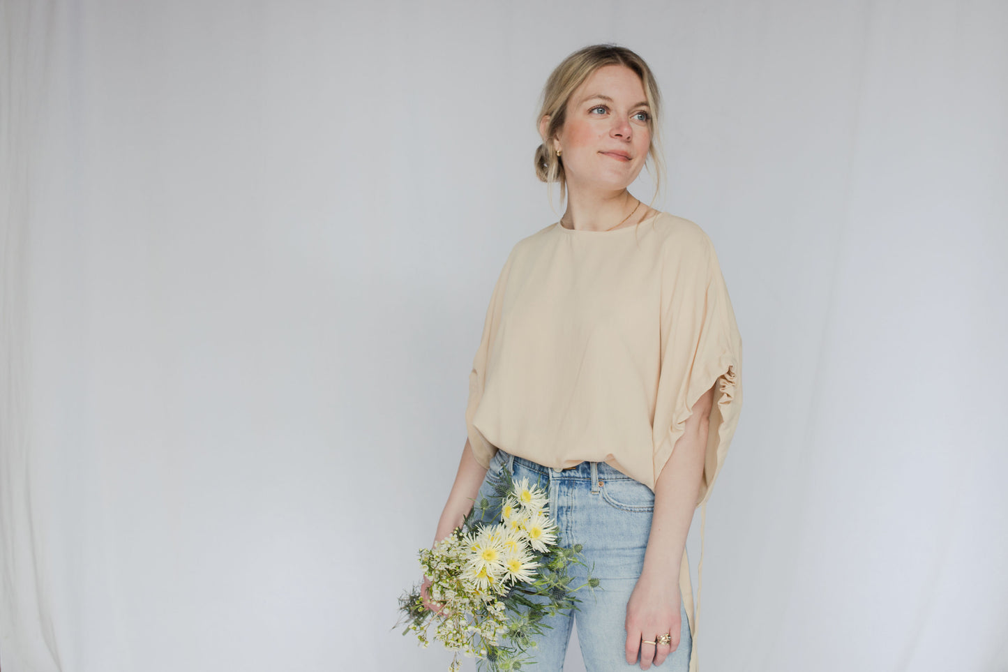 image of model wearing short tie sleeve blouse