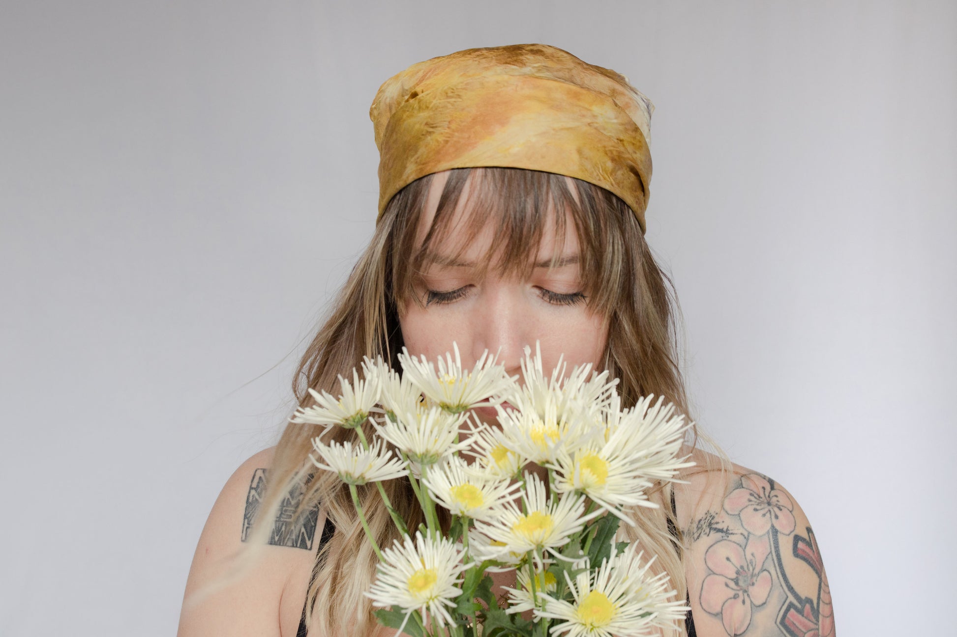 image of model wearing natural dye silk bandana 