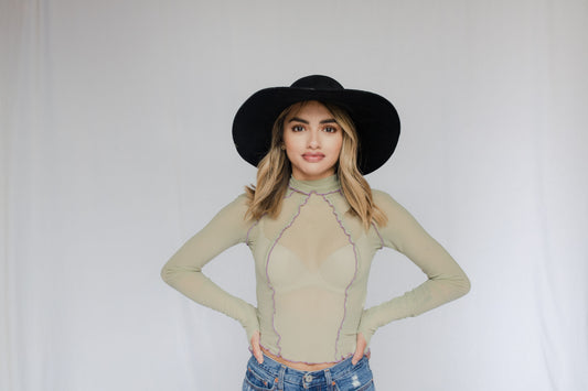 image of model in wavy hem mesh top