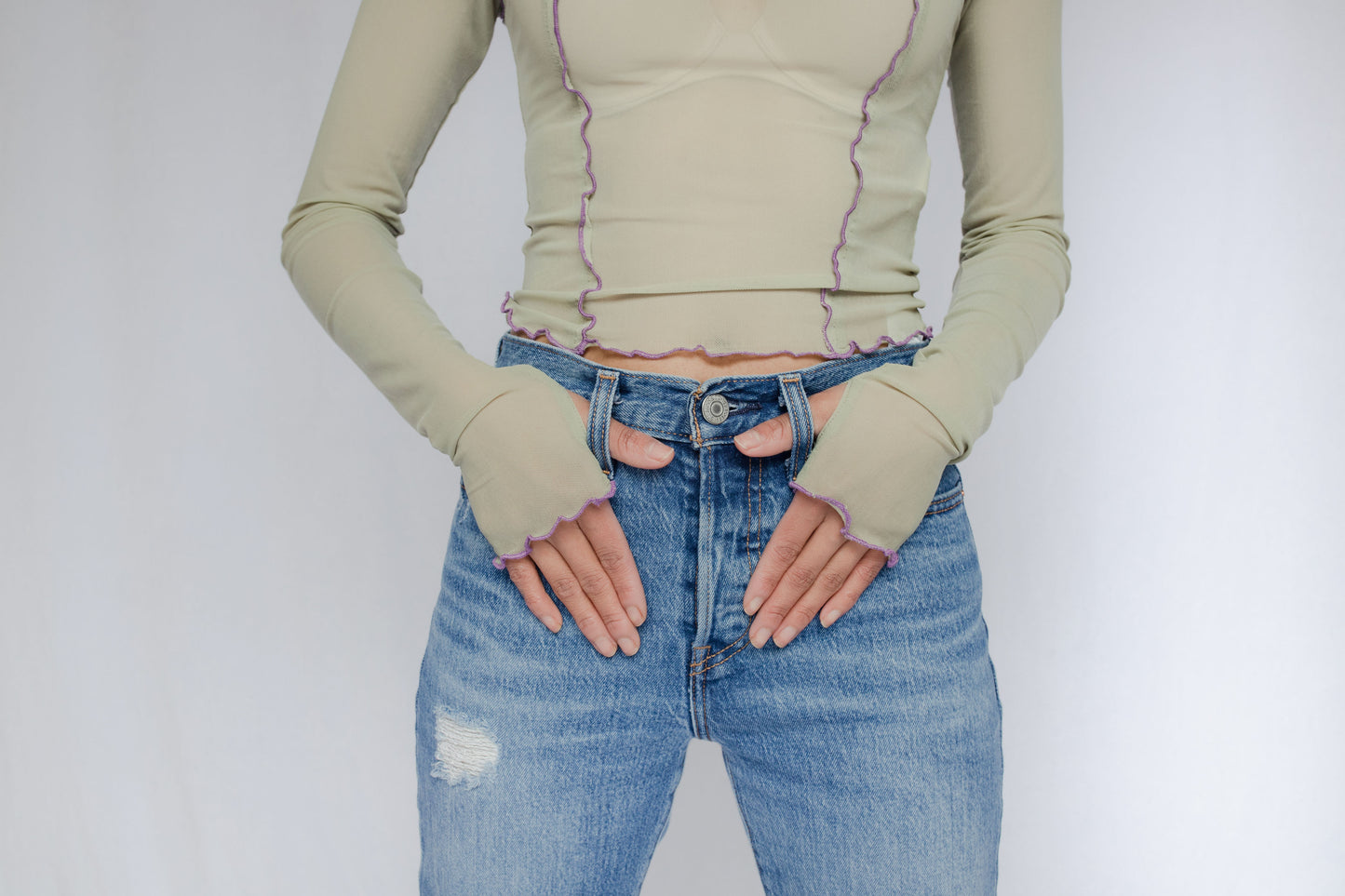 image of model in wavy hem mesh top