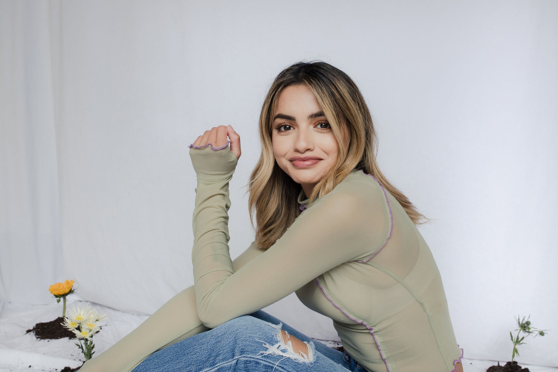 image of model in wavy hem mesh top