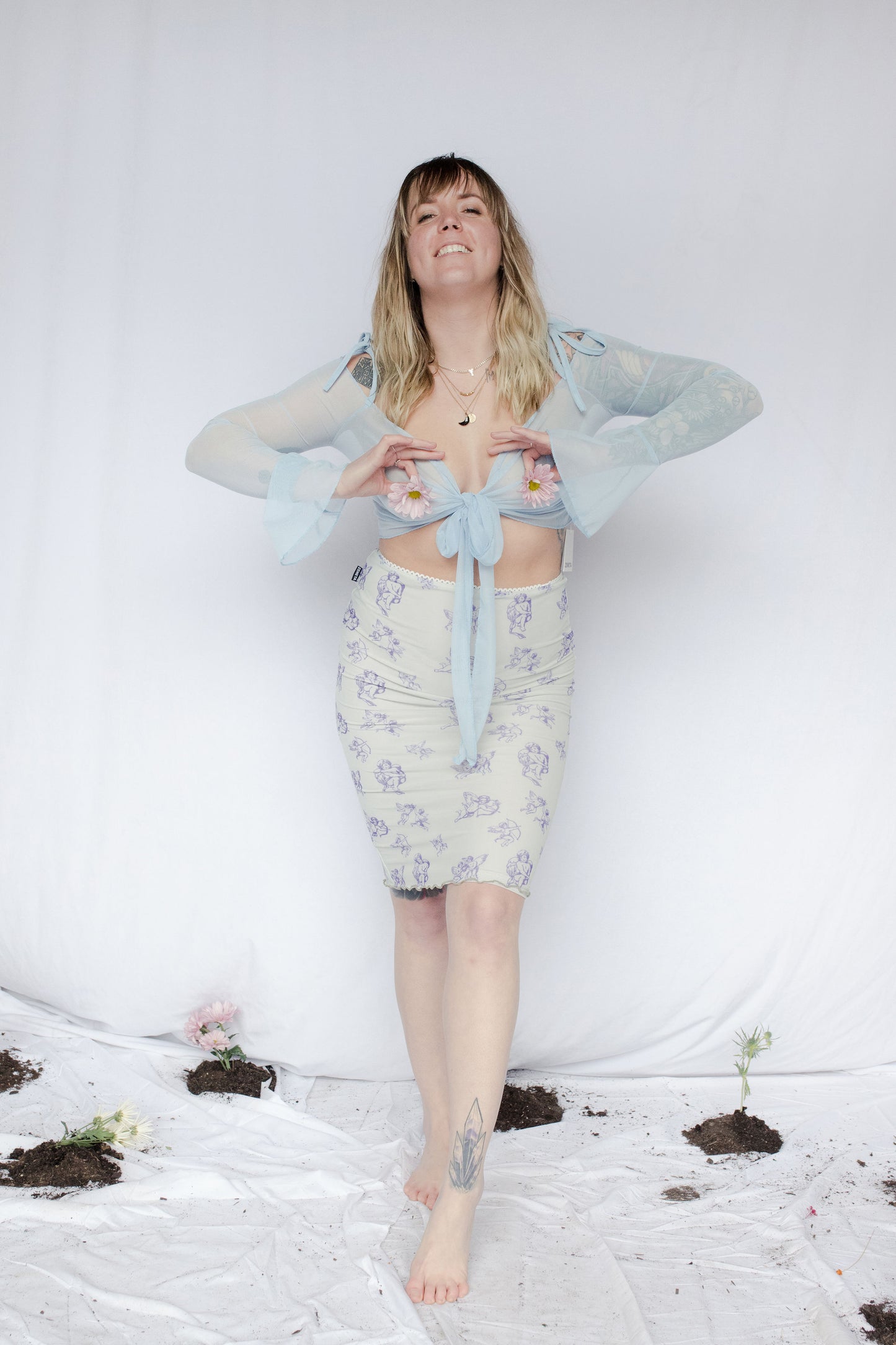 image of model in mesh tie up cardigan