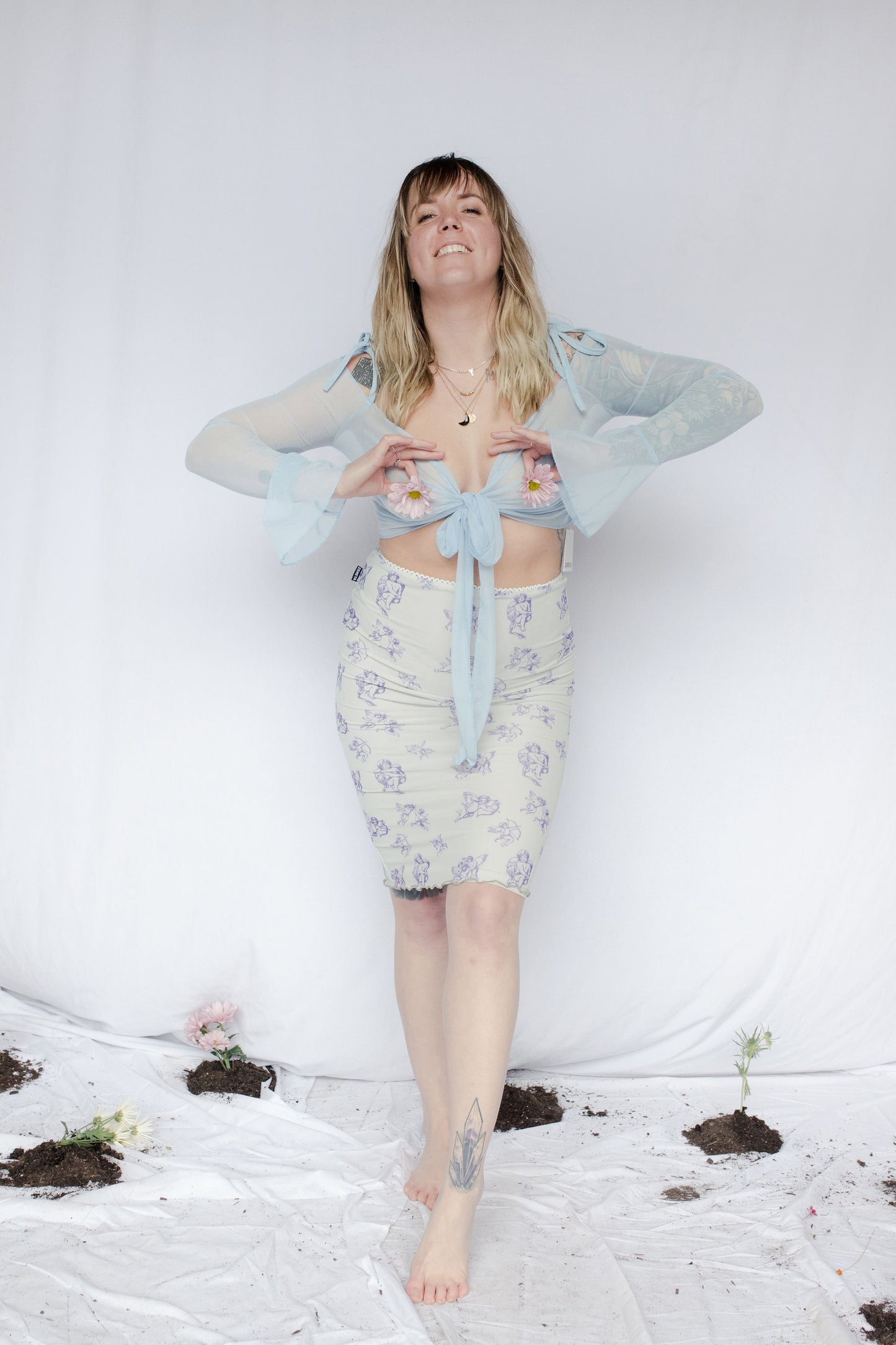 image of model in blue cupid midi lettuce skirt