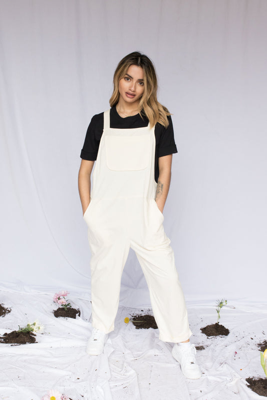 Image of model in overalls & tee