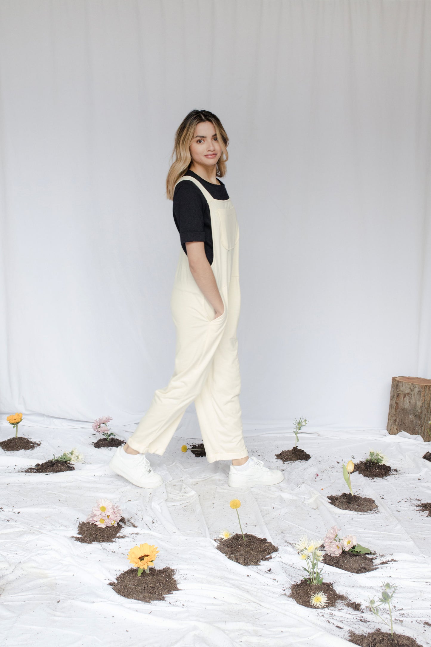 Image of model in overalls & tee