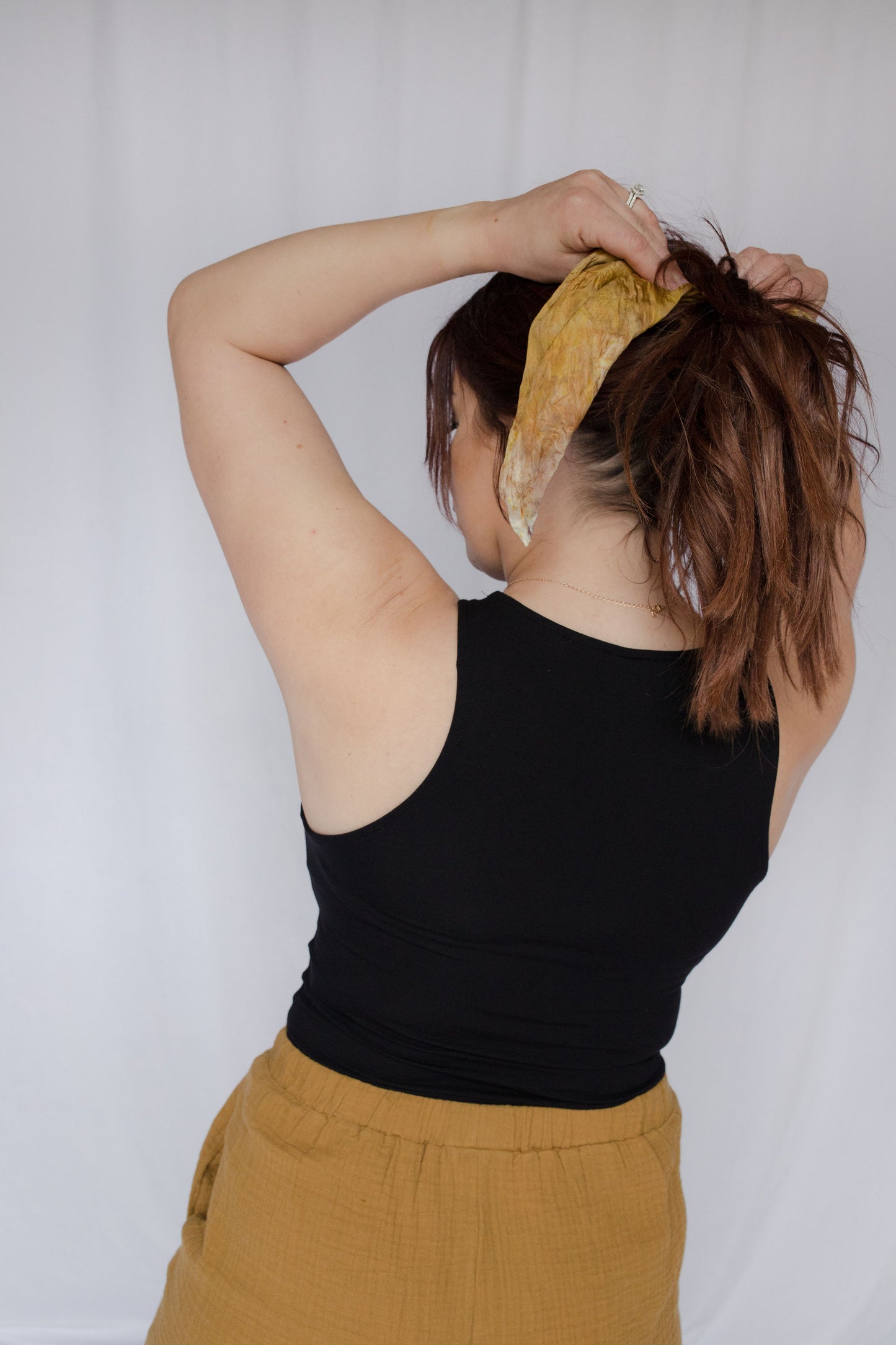 image of model wearing natural dye silk bandana