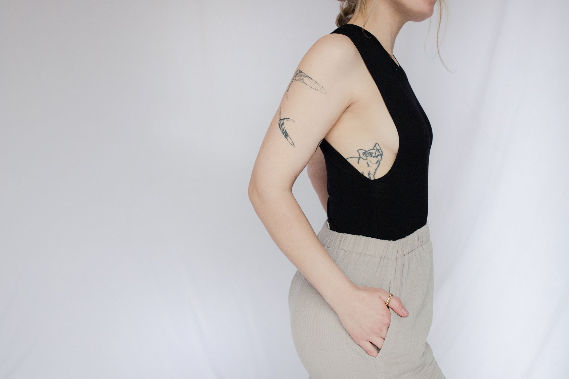 Image of model wearing bamboo muscle tank bodysuit