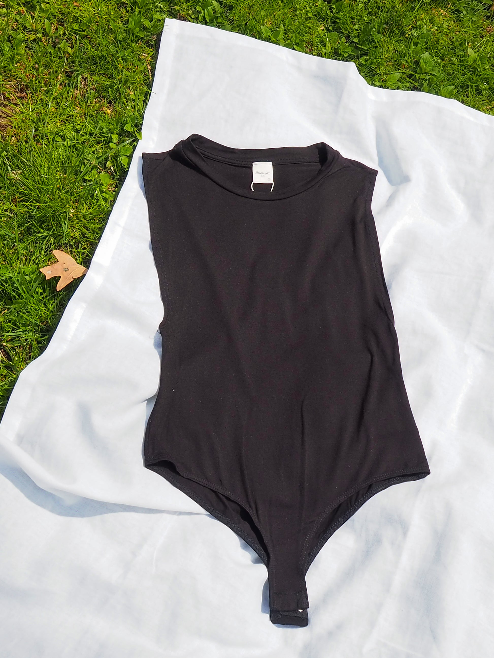 image of muscle tank bodysuit flatlay