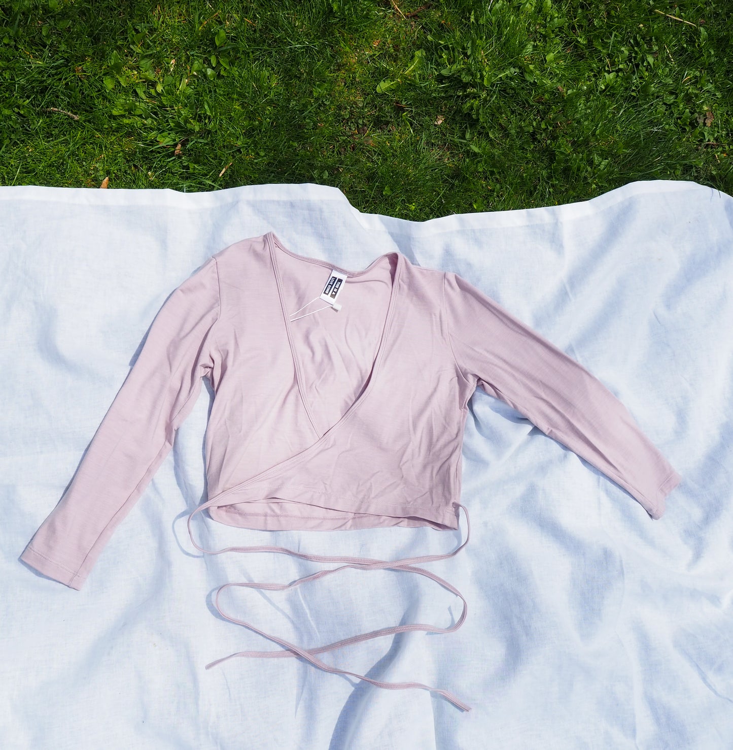 image of model wearing sia wrap top