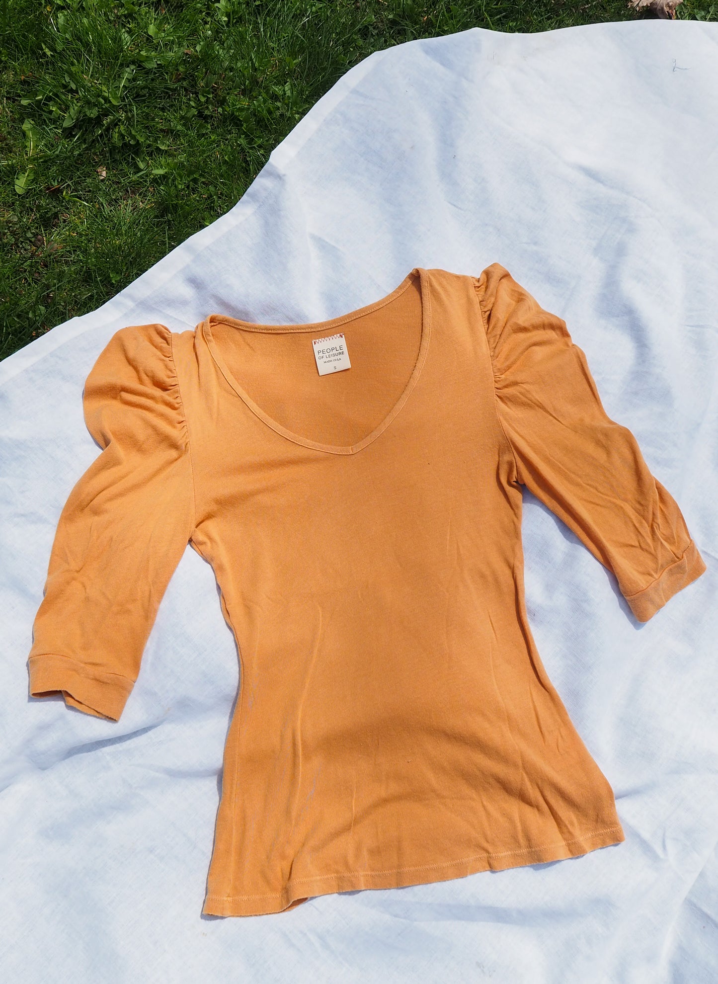 flatlay image of jojo top