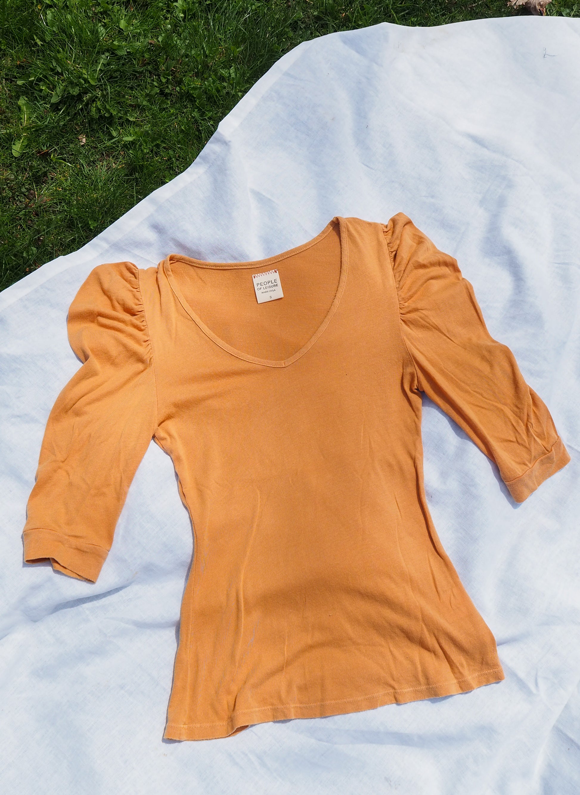 flatlay image of jojo top