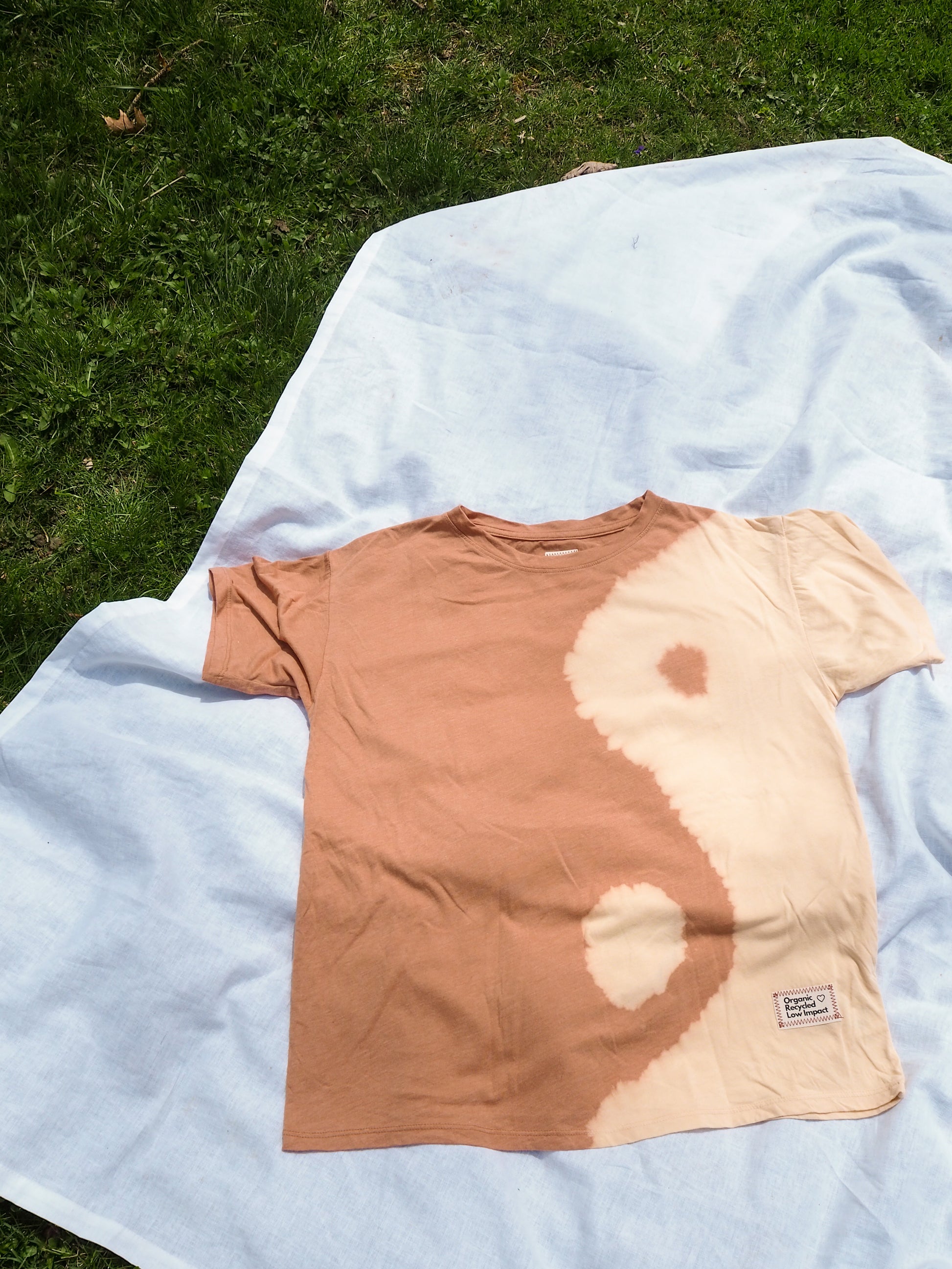 flatlay image of boyfriend ying & yang tie dye tee